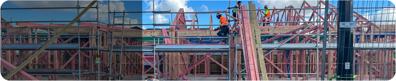 Construction workers framing a new building